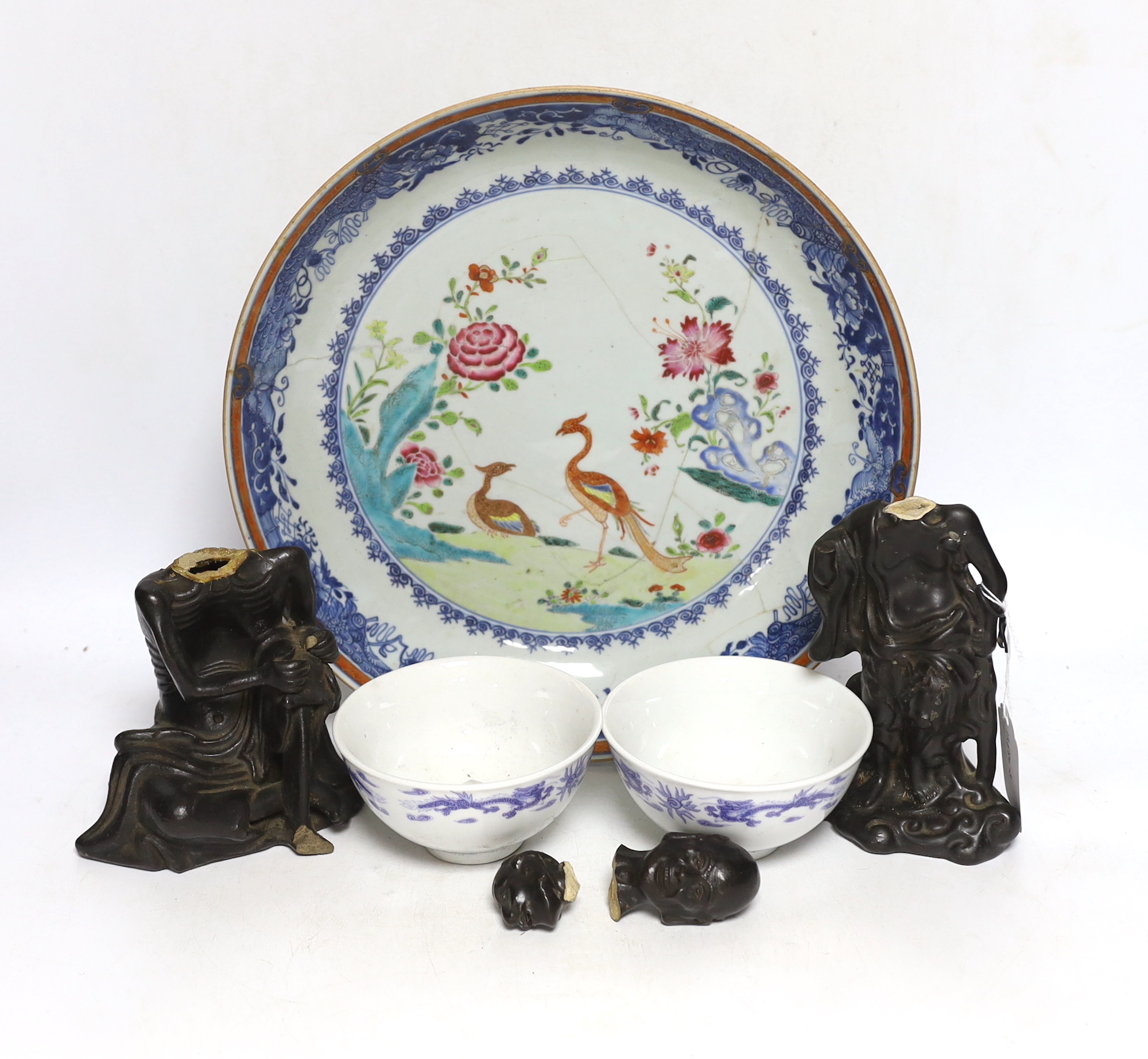 Two Chinese pottery figures of luohan, damaged, 15.5cm and an 18th-century Chinese export famille rose twin pheasant dish and a pair of blue and white bowls, the largest 30cm in diameter